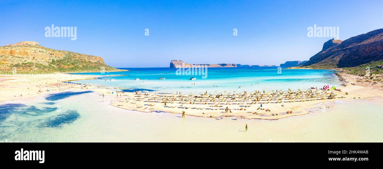 People sunbathing on idyllic white sand beach, Balos, Crete, Greek Islands, Greece, Europe Stock Photo