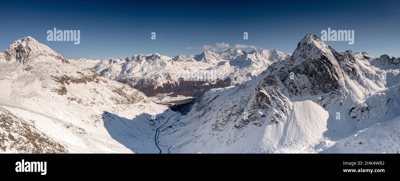 Aerial view of Julier Pass mountain road in the snow leading to St. Moritz in winter, Engadine, Graubunden canton, Switzerland, Europe Stock Photo