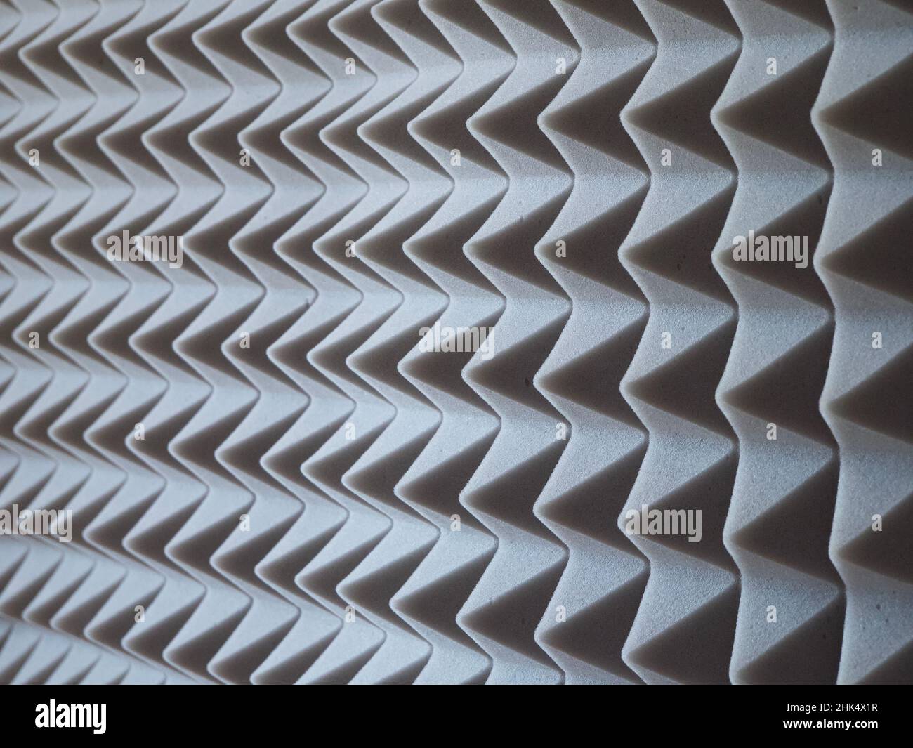 Grey acoustic foam rubber. Soundproof pyramids, full frame. Stock Photo