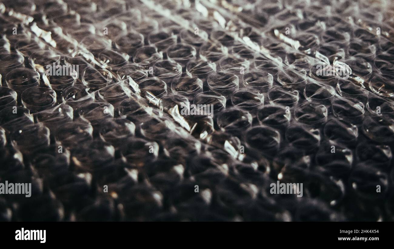 Bubble wrap is a pliable transparent plastic material used for packing