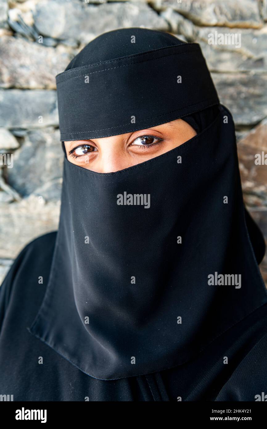 Veiled woman, Rijal Almaa mountain village, Asir Mountains, Kingdom of Saudi Arabia, Middle East Stock Photo