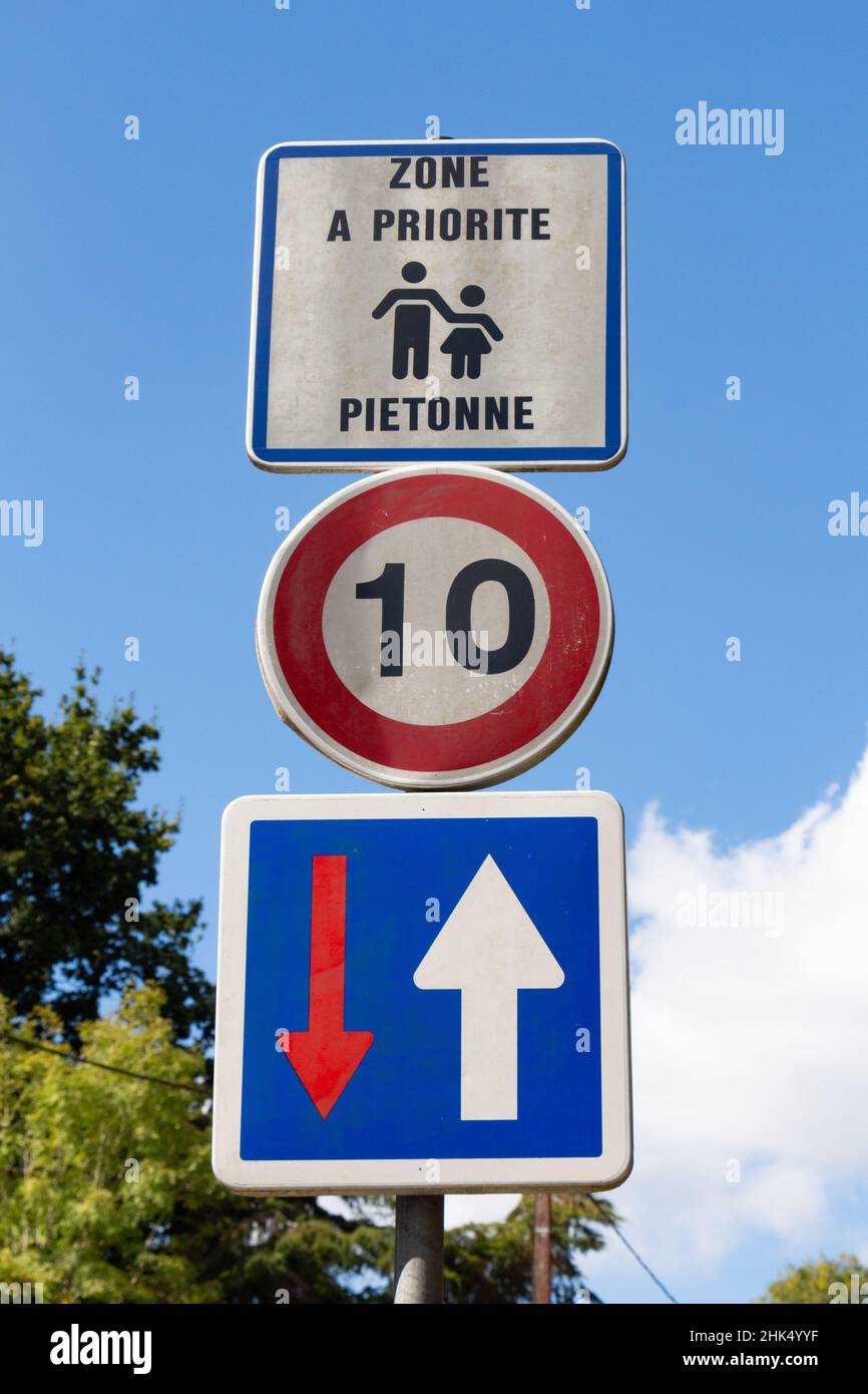 Road sign pedestrian priority written in french language, 10 kilometers per hour and priority