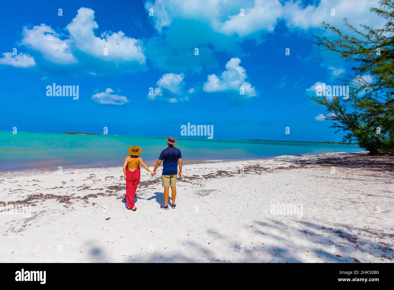 Couple enjoying the white sands and epic ocean view of Horse Stable Beach, North Caicos, Turks and Caicos Islands, Atlantic, Central America Stock Photo