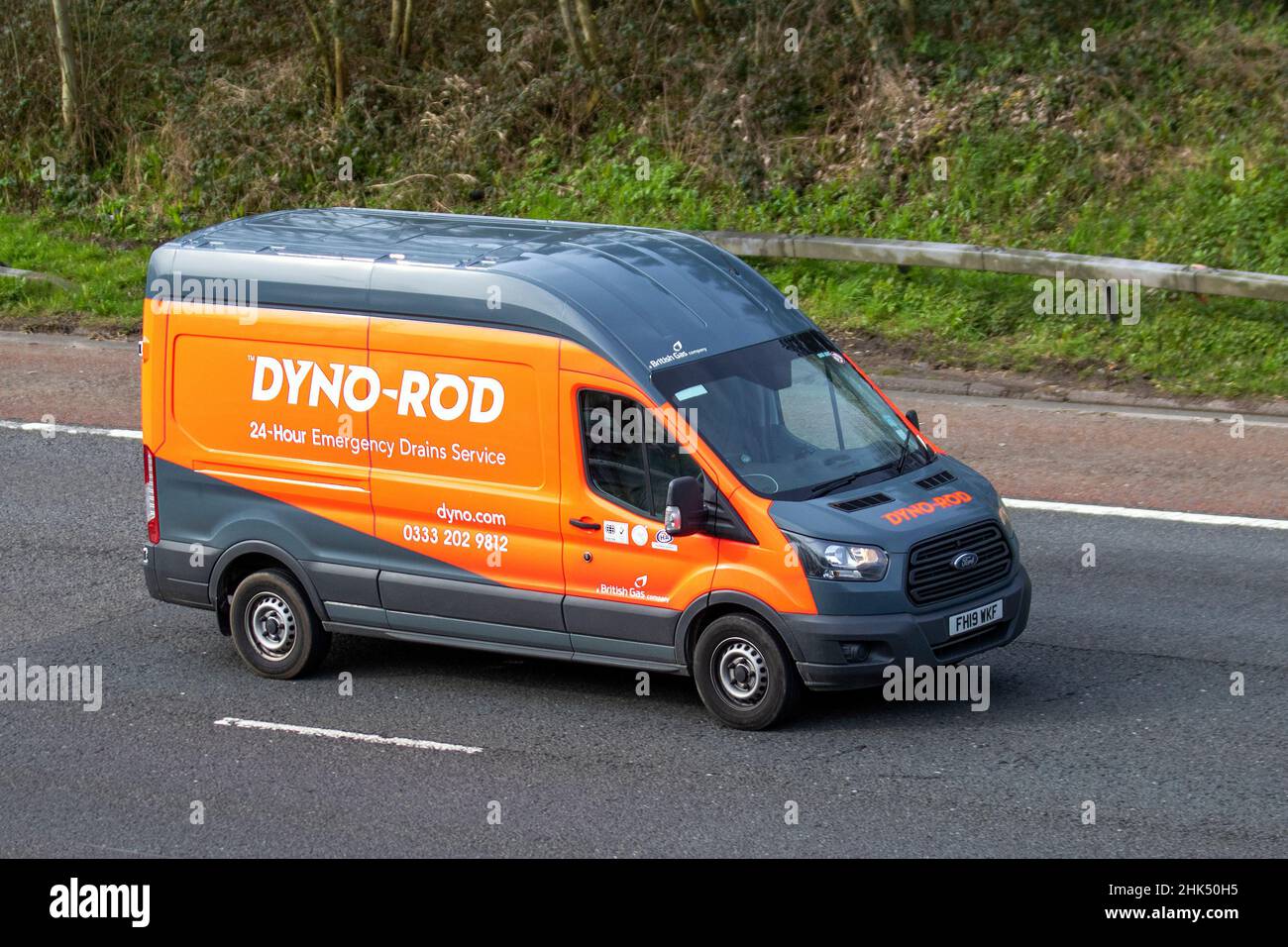 Dyno-Rod 24-hour Emergency Drains Service, a British Gas Company 2019 Ford Transit service vehicle. UK; Vehicular traffic, moving vehicles, cars, vehicle driving on UK roads, motors, motoring on the M6 motorway highway UK road network. Stock Photo