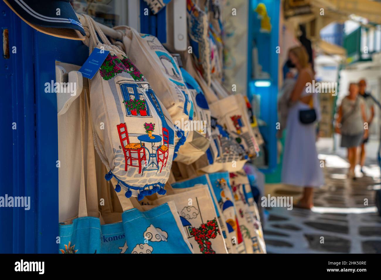 Souvenir bags for sale in narrow street in Mykonos Town, Mykonos, Cyclades Islands, Greek Islands, Aegean Sea, Greece, Europe Stock Photo