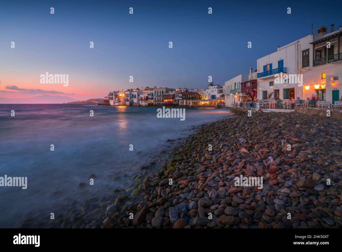 View of restaurants and pebble beach at Little Venice in Mykonos Town at night, Mykonos, Cyclades Islands, Greek Islands, Aegean Sea, Greece, Europe Stock Photo