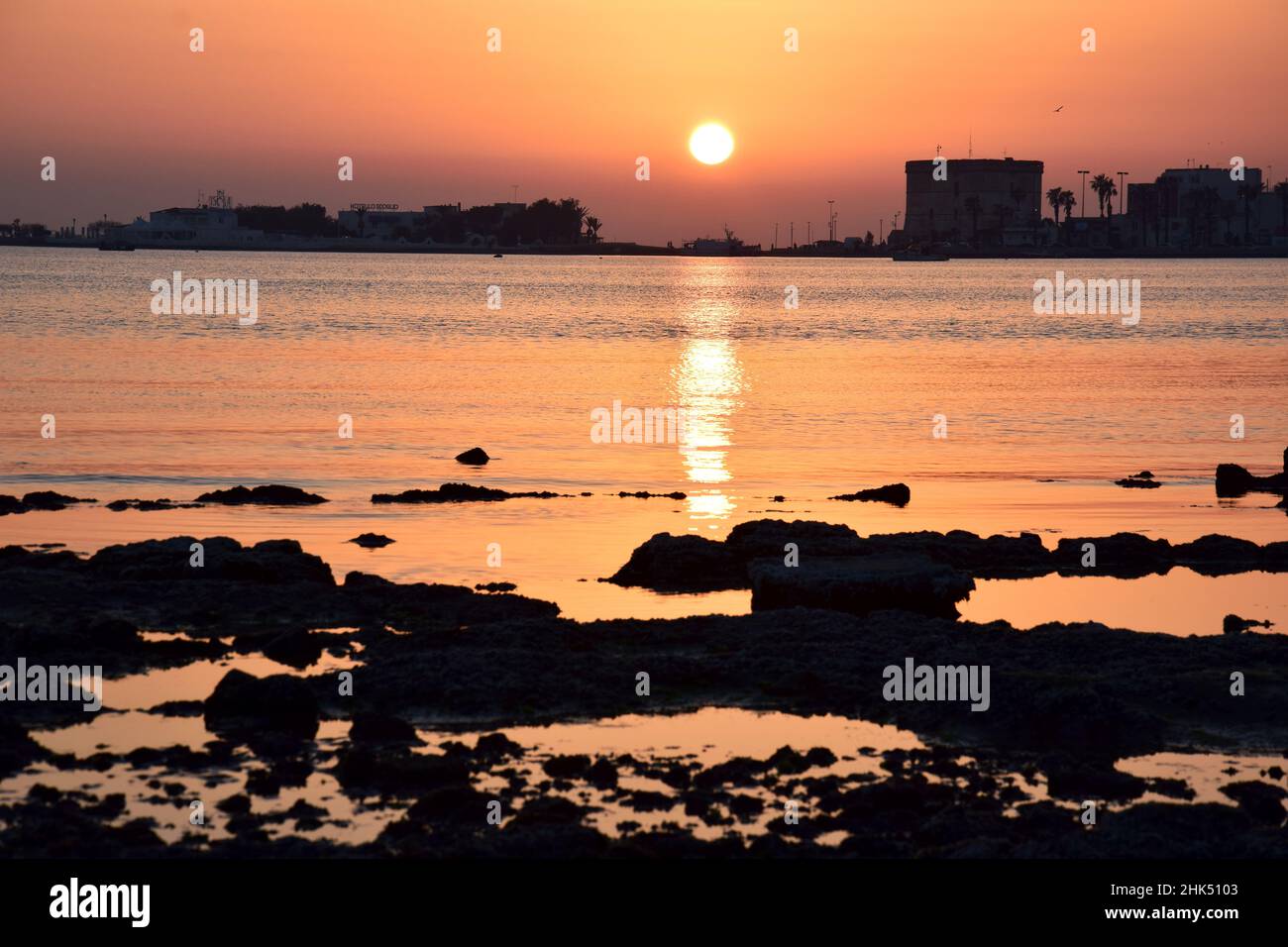 Golden sea at sunset Stock Photo - Alamy