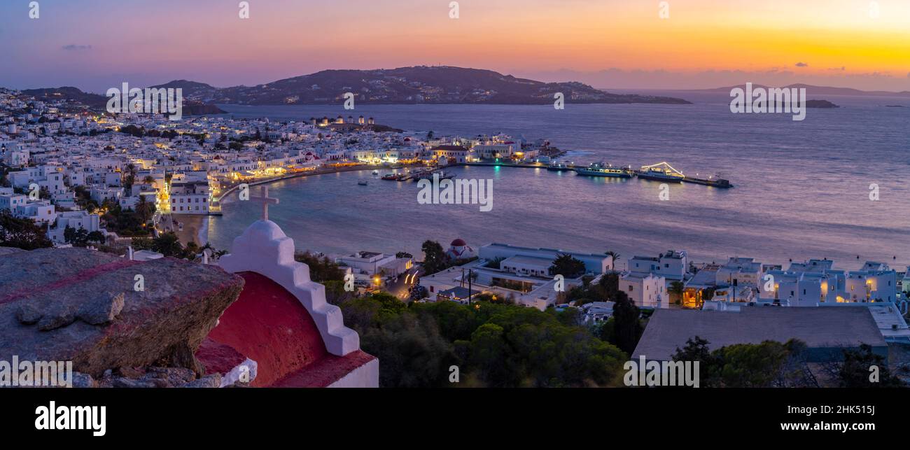 View of chapel and town from elevated view point at dusk, Mykonos Town, Mykonos, Cyclades Islands, Greek Islands, Aegean Sea, Greece, Europe Stock Photo