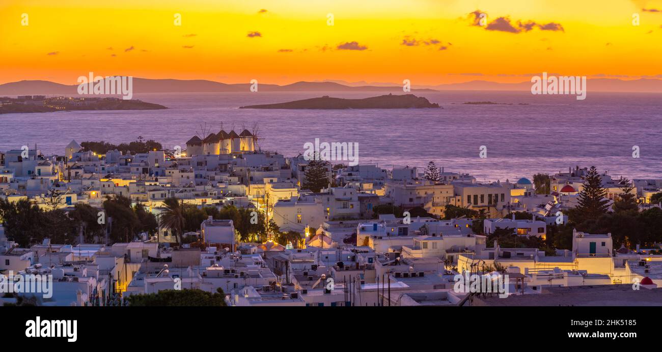 View of windmills and Aegean Sea from elevated position at sunset, Mykonos Town, Mykonos, Cyclades Islands, Greek Islands, Aegean Sea, Greece, Europe Stock Photo