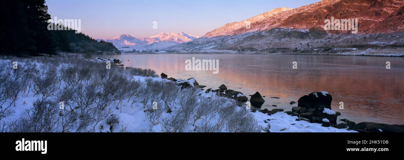 Mount Snowdon in snow at sunrise with frozen LLynnau Mymbyr lake, Capel Curig, Snowdonia National Park, Wales, United Kingdom, Europe Stock Photo