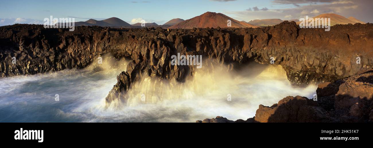 Volcanic coastline with waves crashing into sea caves, Los Hervideros, Timanfaya National Park, Lanzarote, Canary Islands, Spain, Atlantic, Europe Stock Photo