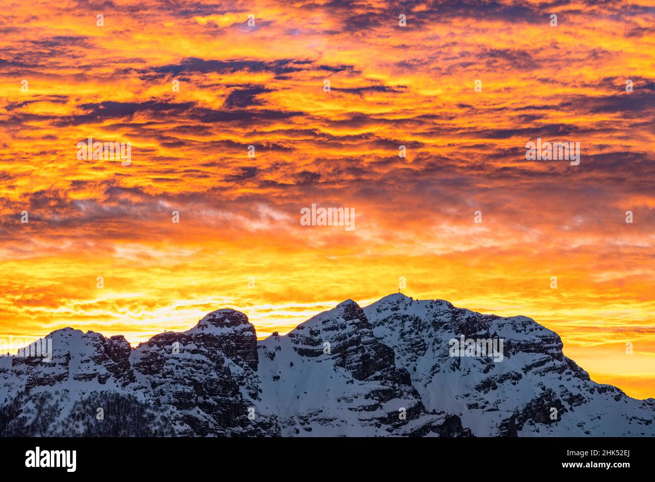 Snowcapped Mount Resegone under the colorful sky at sunrise, Lake Como, Lecco province, Lombardy, Italy, Europe Stock Photo