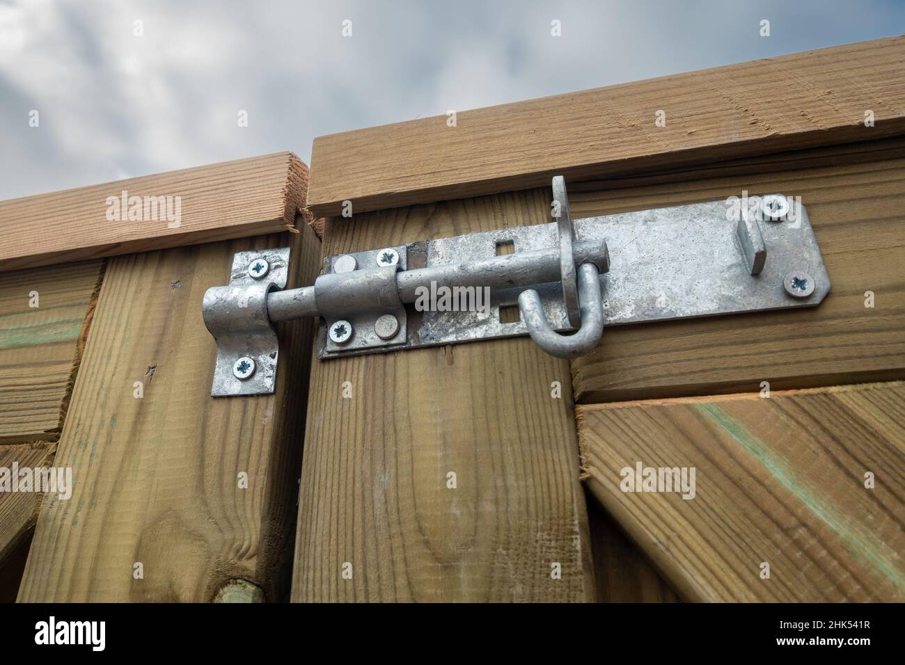 Metal bolt on a wooden gate Stock Photo Alamy