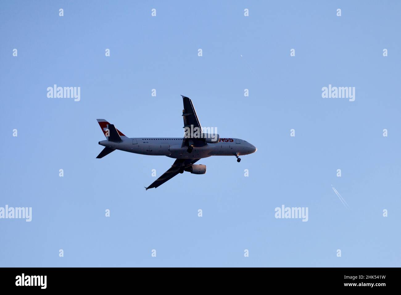 Nice, France - March 26 2019: Airbus A320-214 operated by Swiss Air passing over the city. Stock Photo