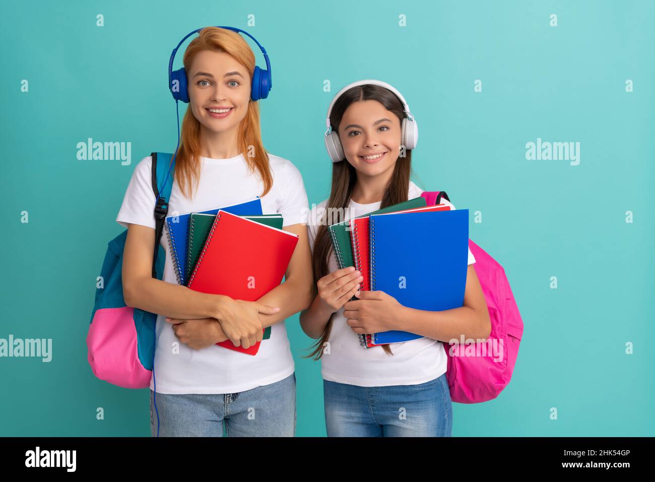 private teacher and child carry backpack. family help. mother and