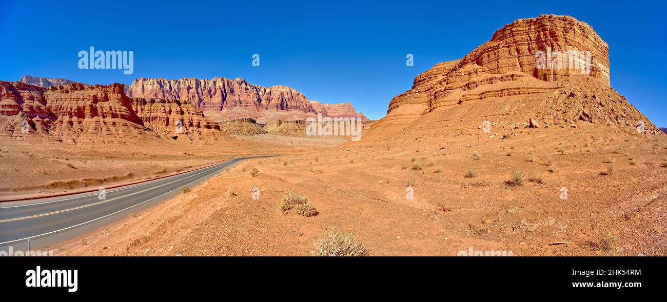 Lee's Ferry Road running between Cathedral Rock and Vermilion Cliffs National Monument in Glen Canyon Recreation Area, Arizona Stock Photo