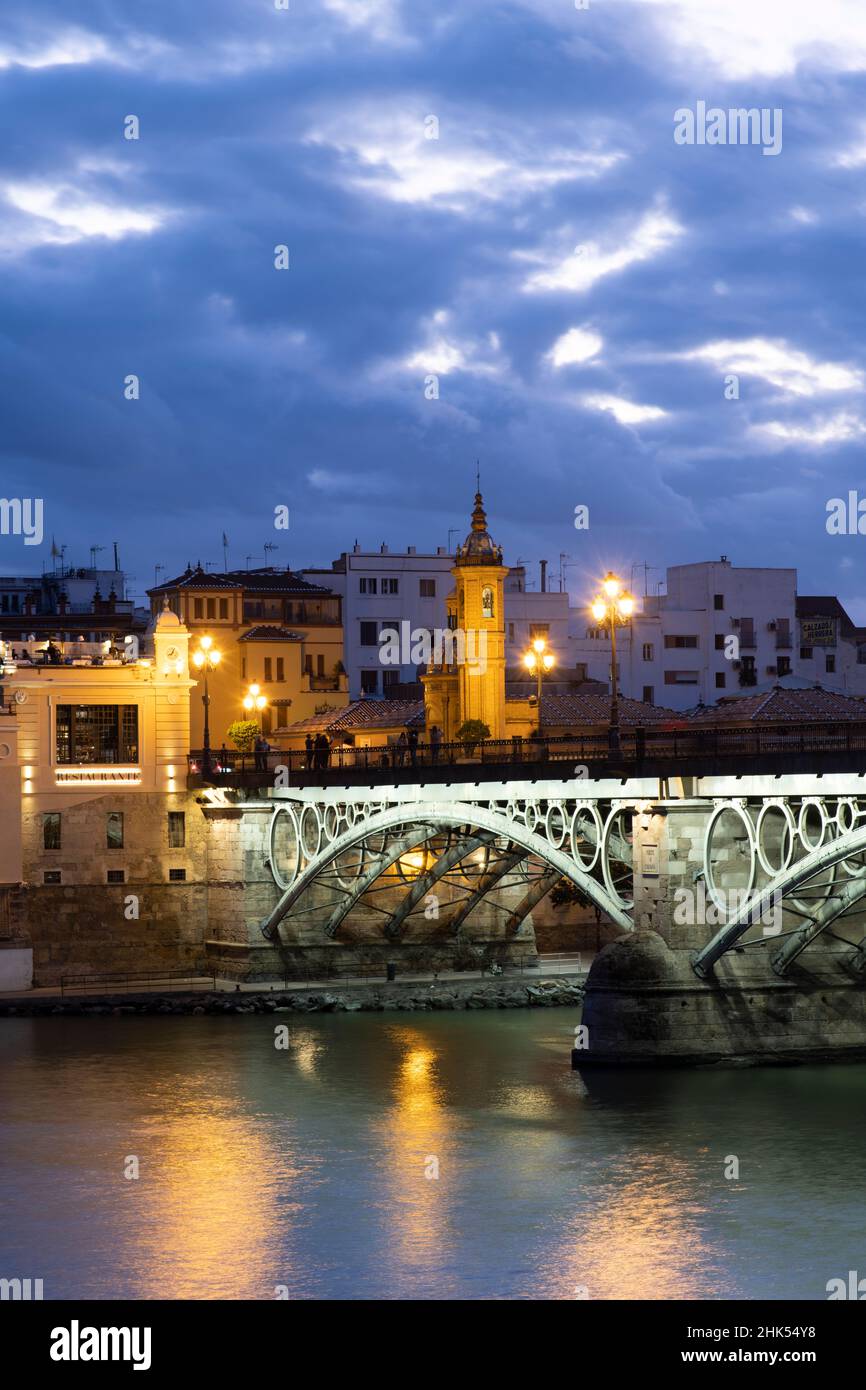 The Triana Bridge (Puente de Triana) (Puente de Isabelle II) at twilight,  Seville, Andalucia Spain, Europe Stock Photo - Alamy