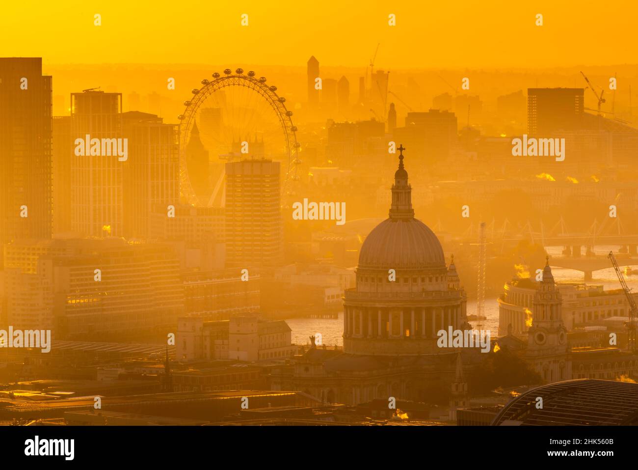 View of London Eye and St. Paul's Cathedral at golden hour from the Principal Tower, London, England, United Kingdom, Europe Stock Photo