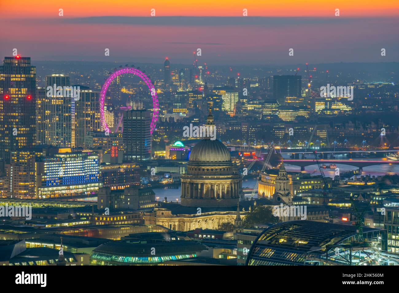 View of London Eye and St. Paul's Cathedral at dusk from the Principal Tower, London, England, United Kingdom, Europe Stock Photo