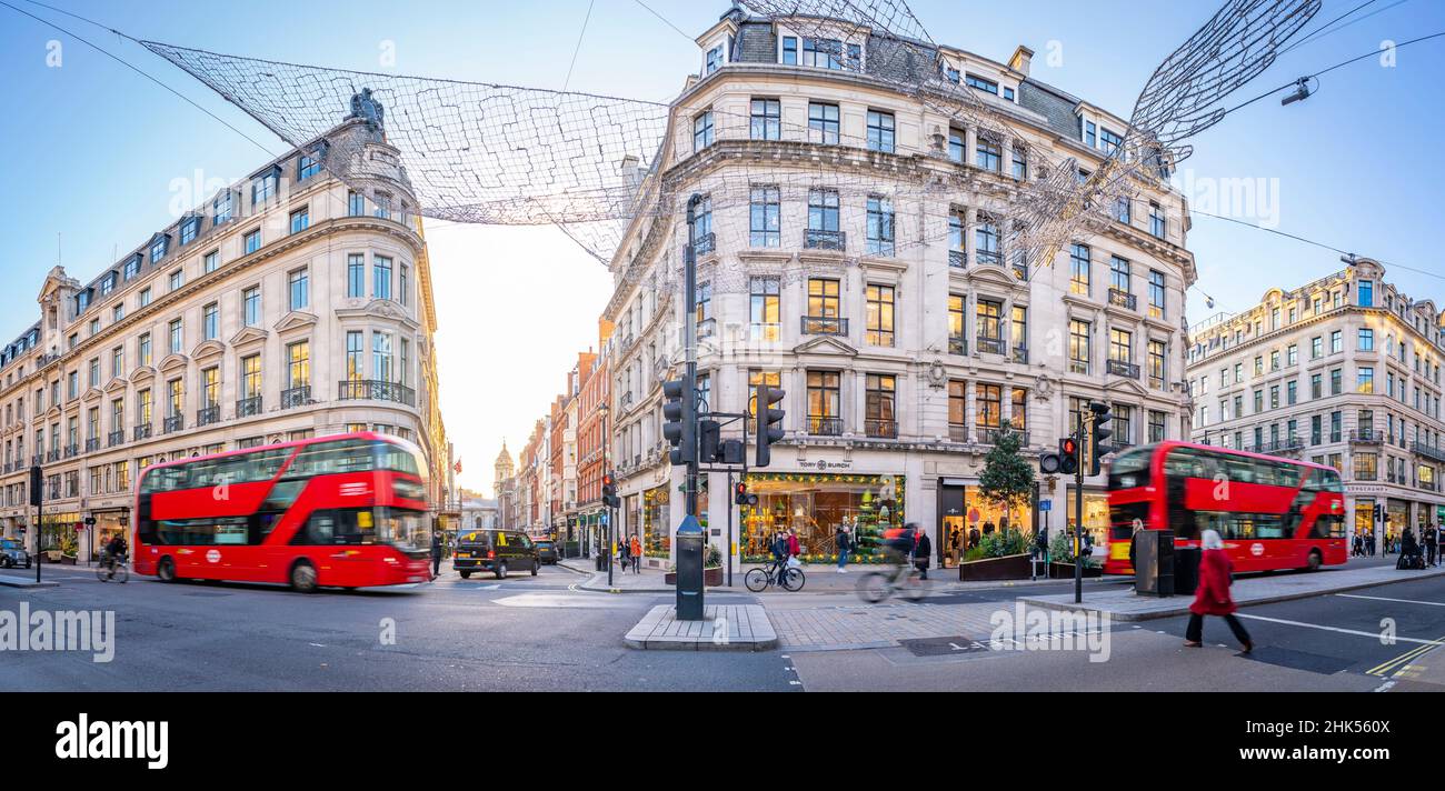 View of red buses on Regent Street at Christmas, London, England, United Kingdom, Europe Stock Photo