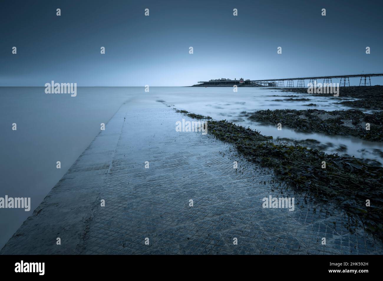 The Anchor Head slipway and Birnbeck Pier in the Bristol Channel at Weston-super-Mare, North Somerset, England. Stock Photo