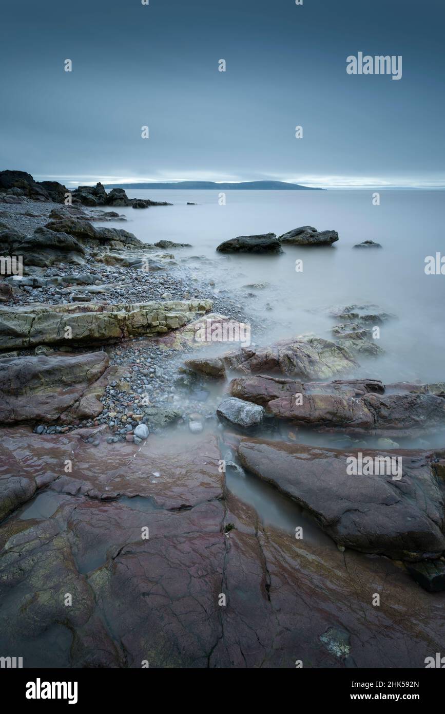 The shore of the Bristol Channel at Anchor Head in Weston-super-Mare with Brean Down promontory beyond, North Somerset, England. Stock Photo