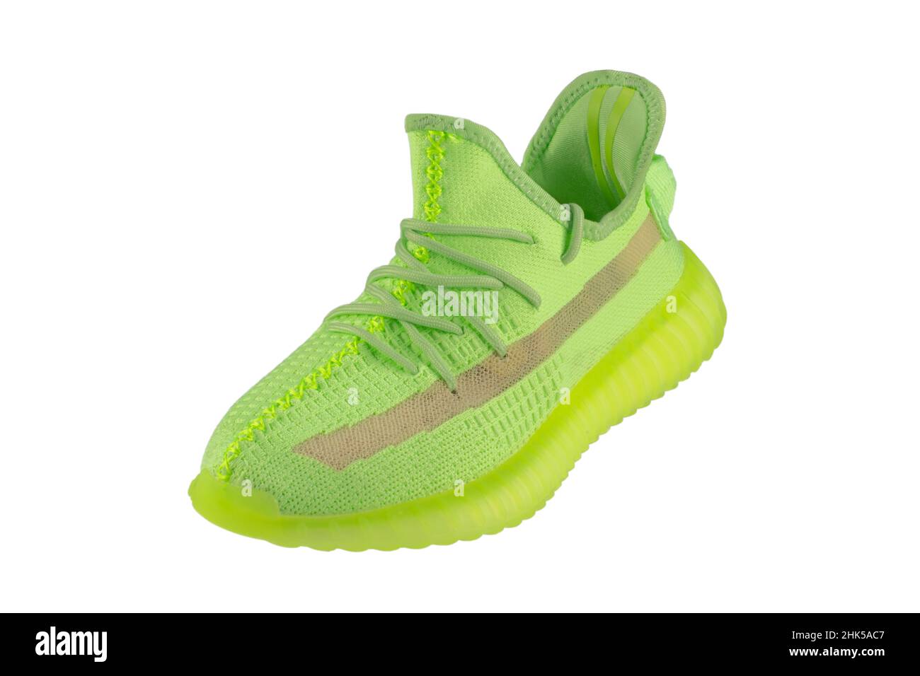 Green rag sneaker with a polyurethane sole on a white background. Stock Photo