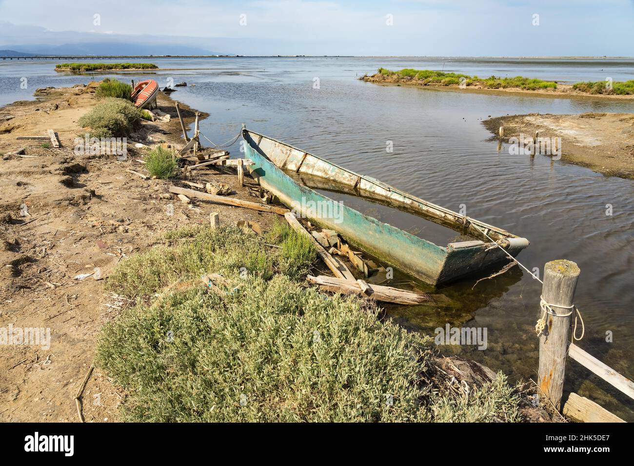 Old fishing boats stranded on the shore of the Delta del Ebro Stock Photo