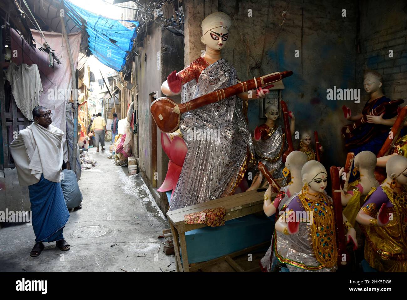 Kolkata, West Bengal, India. 2nd Feb, 2022. An old man stands beside a Saraswati goddess idol making workshop in Kolkata, India, 02 February, 2022. (Credit Image: © Indranil Aditya/ZUMA Press Wire) Stock Photo