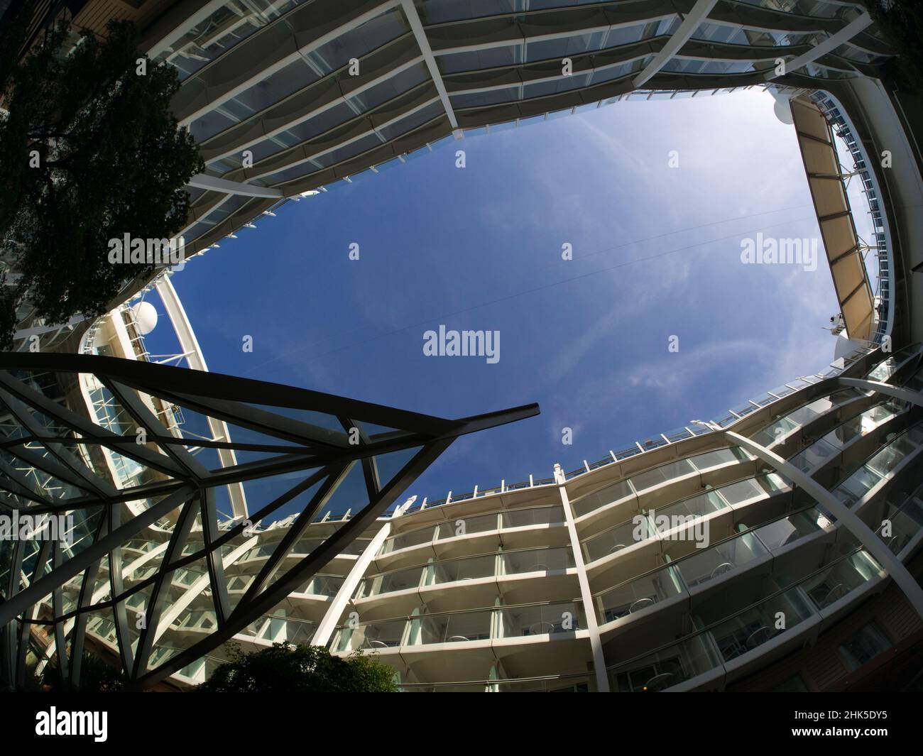 On board cruise ship Oasis of the Seas, looking up to the skies from a massive open-air park and atrium - known, appropriately enough, as Central Park Stock Photo