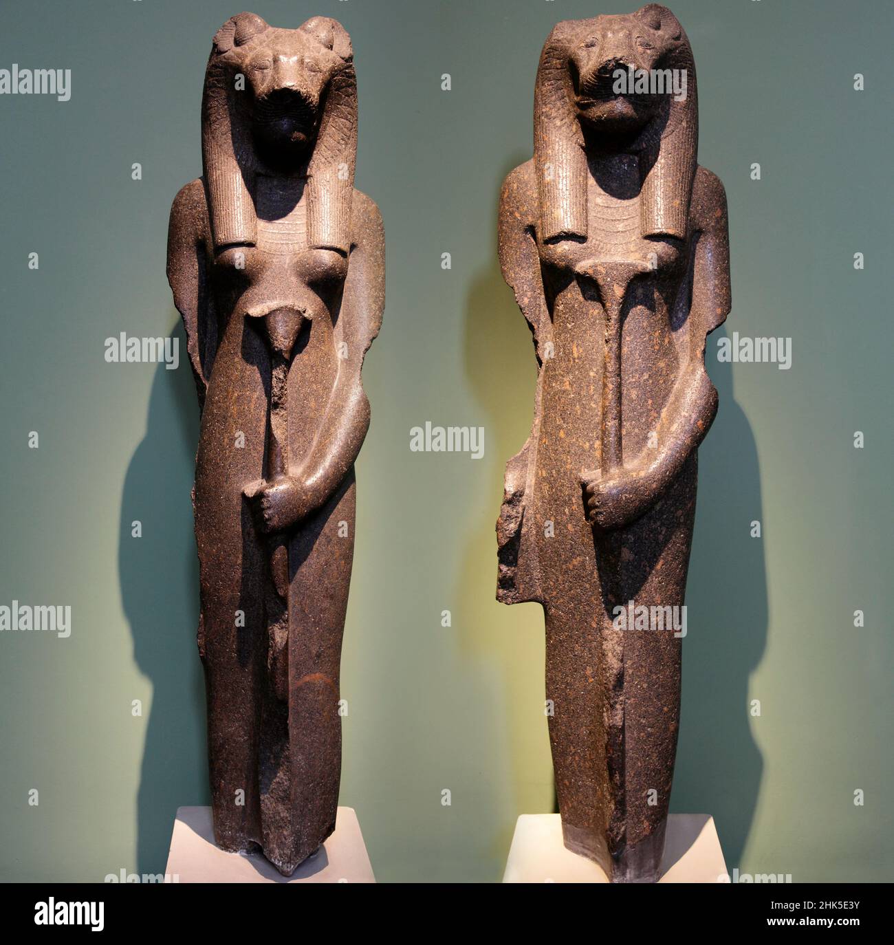 These beautiful and refined 18th Dynasty ancient Egytptian statuettes depict Sekhmet, the revered cat god. They originate from Thebes and   Establishe Stock Photo