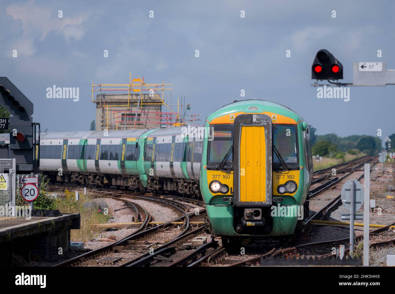 Southern Railway class 377 passenger train  and railway signal, England. Stock Photo