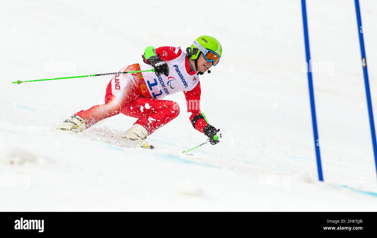 Maciej KREZEL of Poland follows the shouts of his guide in the Mens Alpine Skiing Giant Slalom during the 2014 Winter Paralympic Games at the Rosa Khu Stock Photo