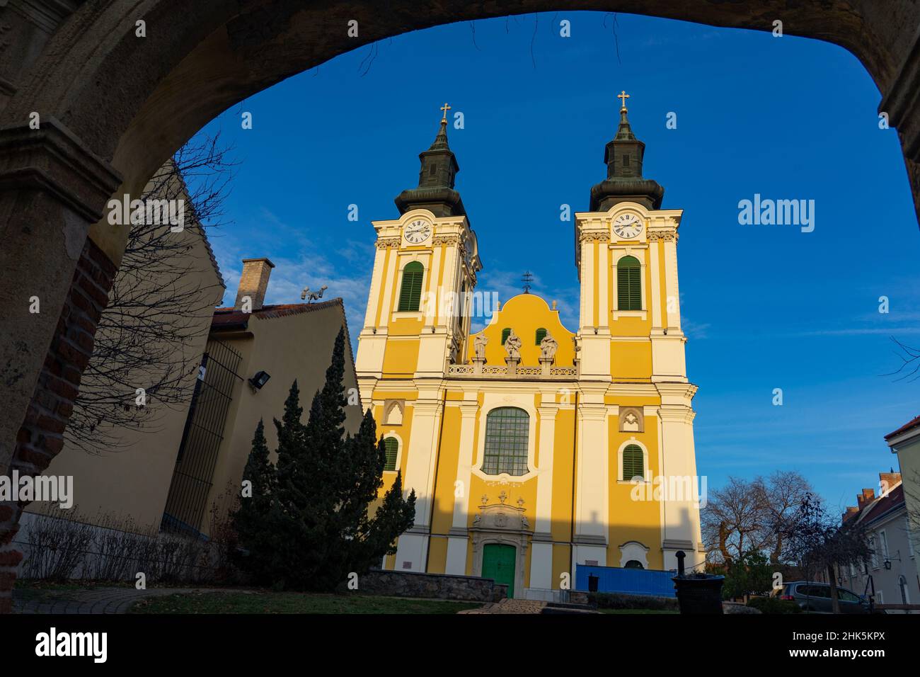 Saint Imre cathedral of Szekesfehervar Hungary with an arch gate Stock Photo