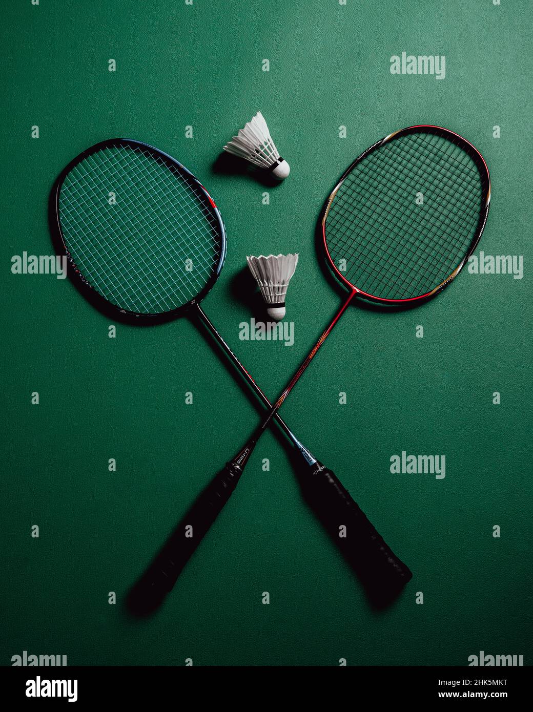 badminton rackets and cocks in the badminton court Stock Photo - Alamy