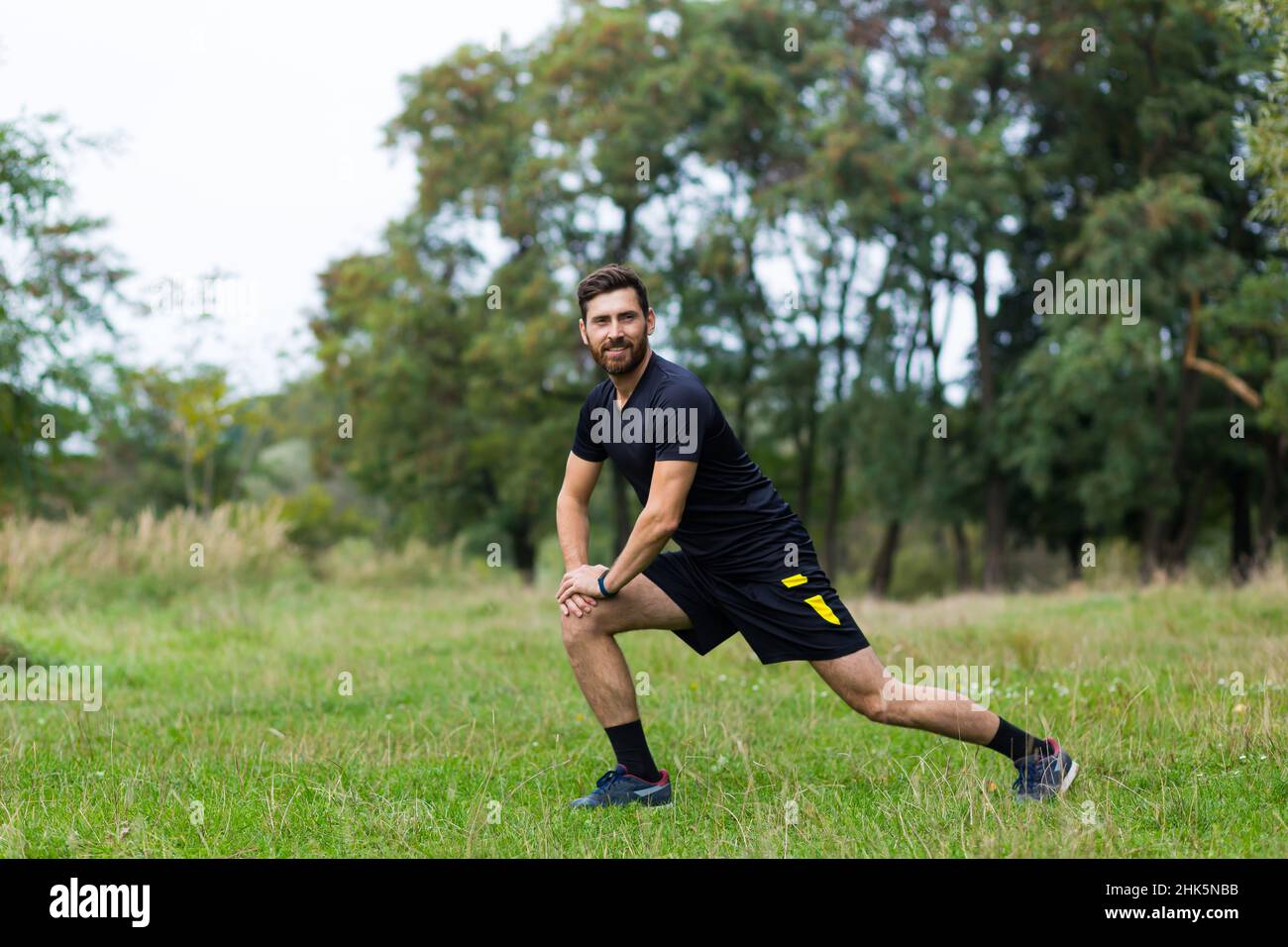 Successful man is engaged in morning fitness training and running ...