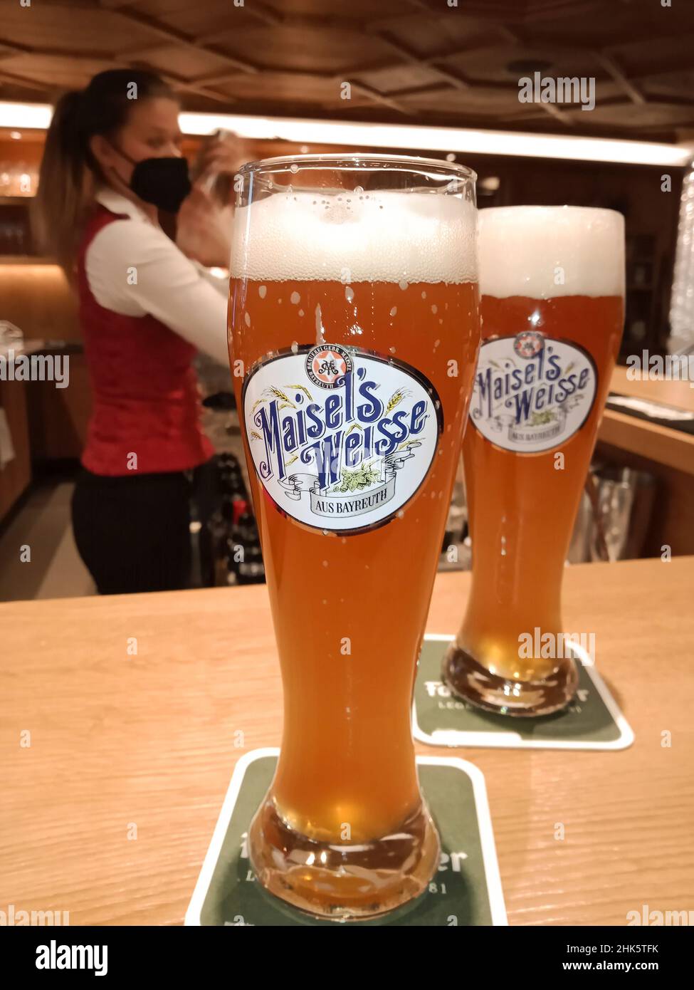 Weizen Bier (wheat beer) on a bar in Austria. Stock Photo