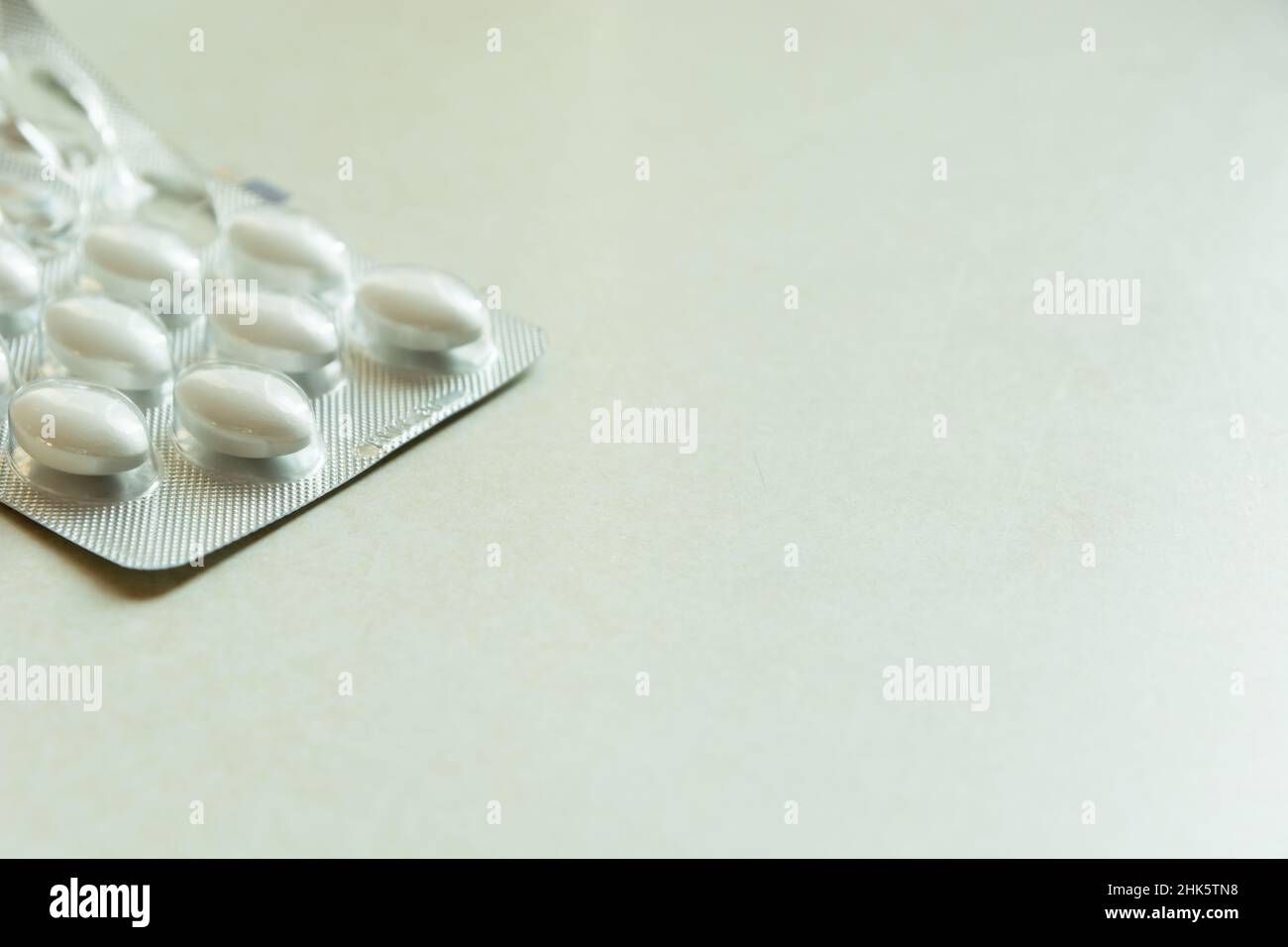 White pills blister pack, place for text, close up Stock Photo