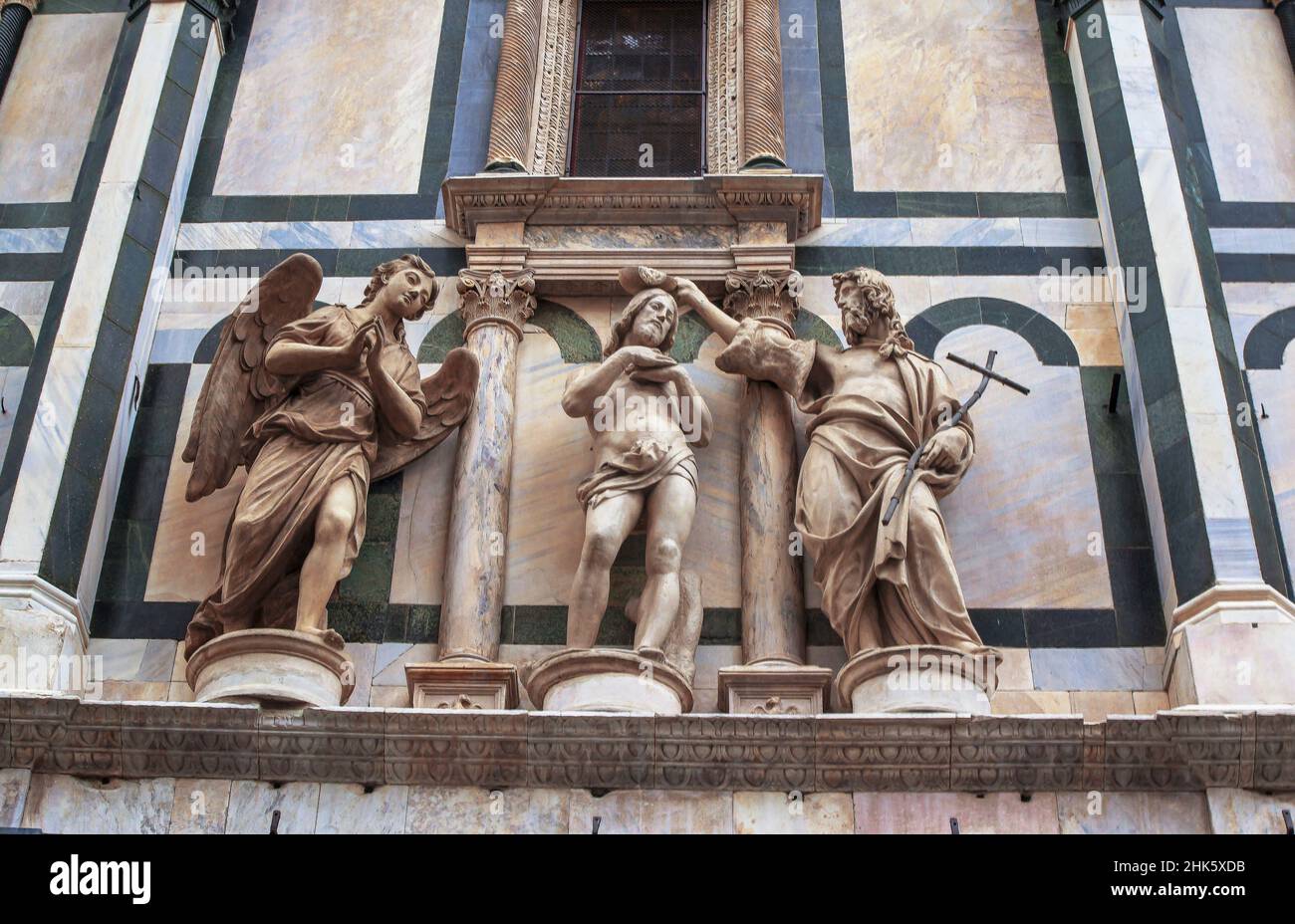 Jesus baptism scene, statues on the facade of Santa Maria del Fiore. Stock Photo