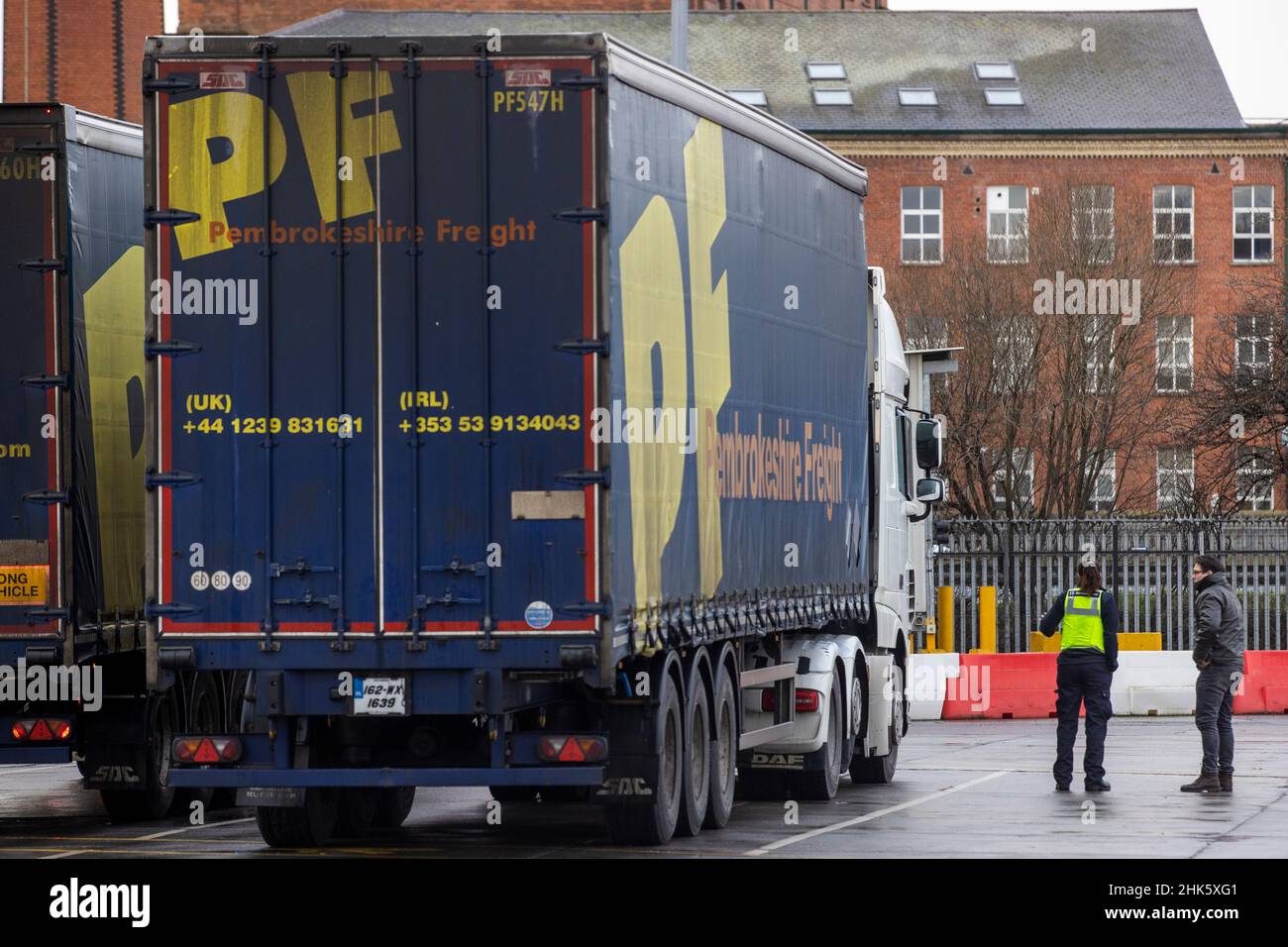 UK Border Force officer speaking with a lorry driver at the NI