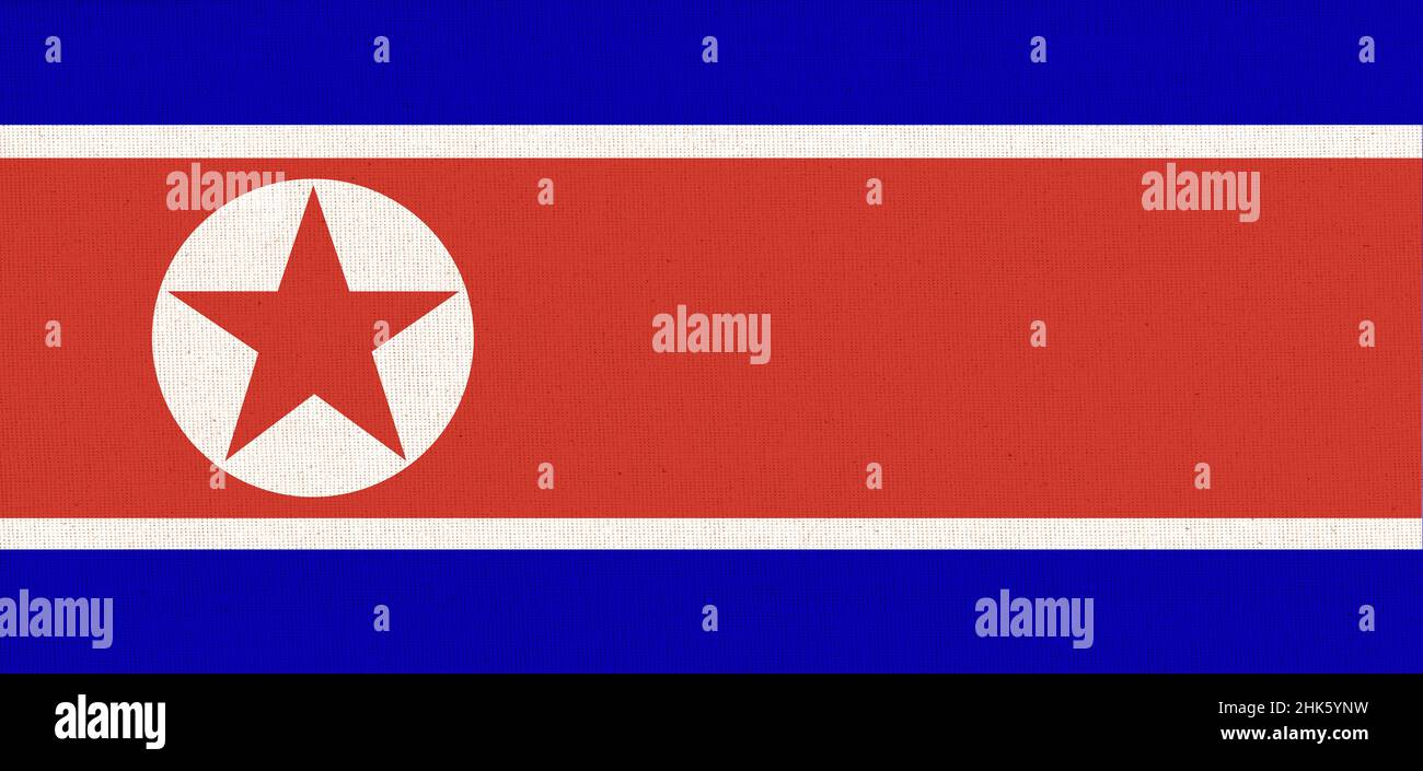 Flag of North Korea. North Korea state symbol. flag of Democratic People Republic of Korea on fabric surface. Fabric Texture. Stock Photo
