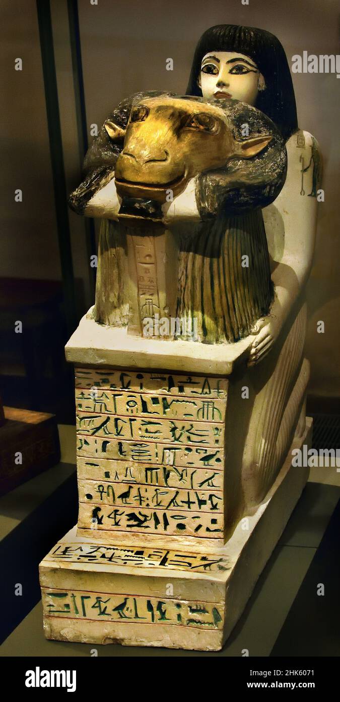 Statue of Penmernab offering a naos topped with a ram-head  Stone / limestone, paint, 63 x 20.3 x 46.5 cm, New Kingdom, Nineteenth 19th Dynasty,  Deir el-Medina,  Egypt (Museo Egizio di Torino Italy) Stock Photo