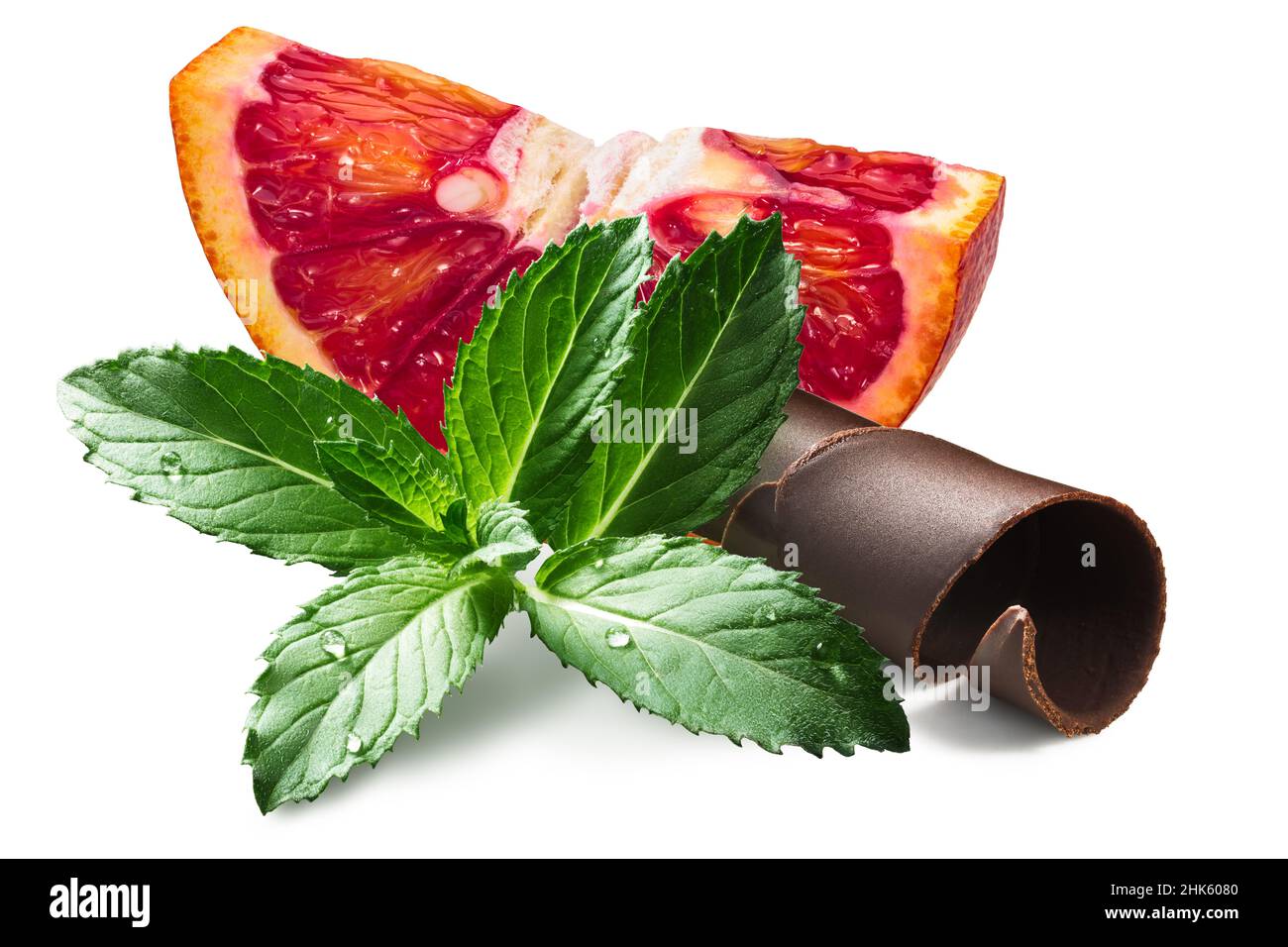Mint with chocolate curled shaving and blood orange slice, isolated Stock Photo