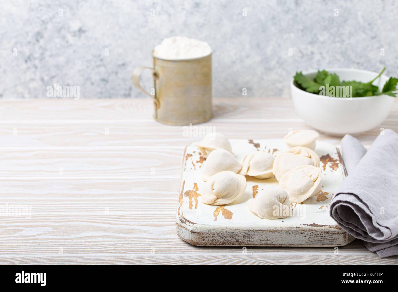 Raw uncooked pelmeni, traditional dish of Russian cuisine, dumplings with minced meat Stock Photo