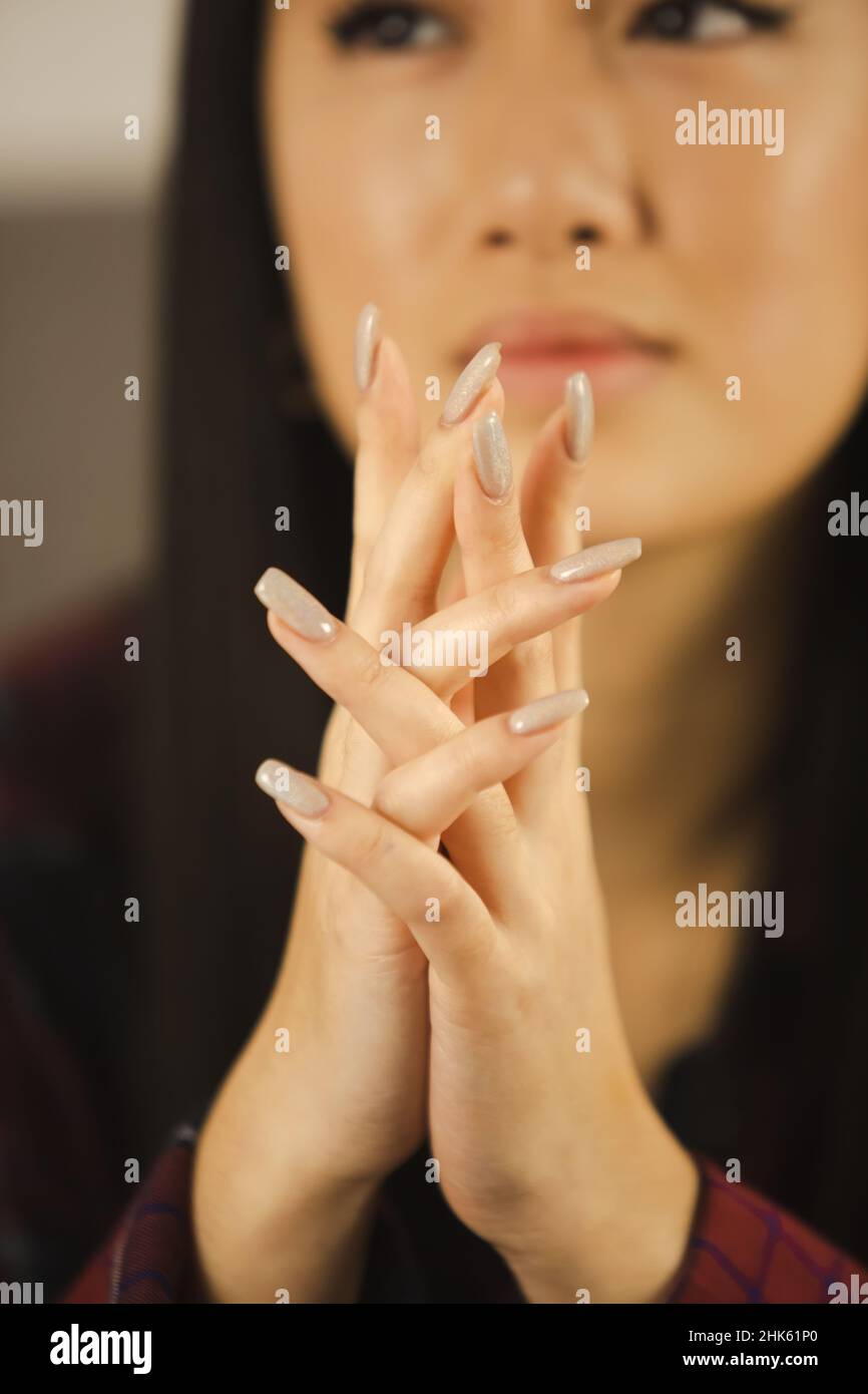 Girls hands with long nails without nail polish. Natural female hands on a  white background top view. Fingers with long nails, well-groomed hands  Stock Photo - Alamy