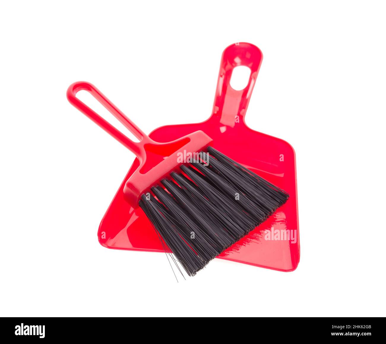 Red brush and plastic dustpan. Isolated on a white background Stock