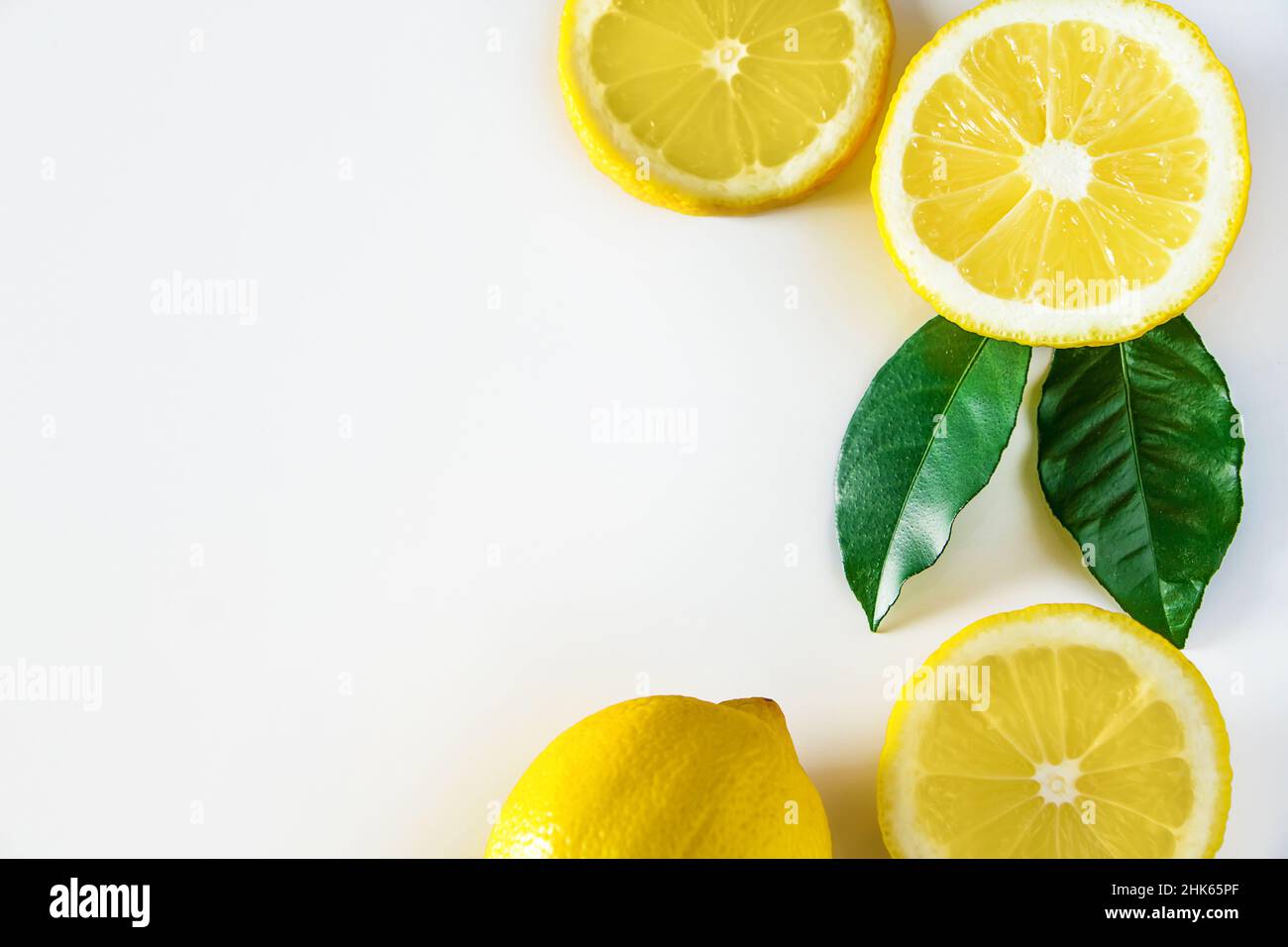 Ripe yellow lemon on white background. Antioxidant for healthy diet. Citrus fruit high in vitamin C. Stock Photo