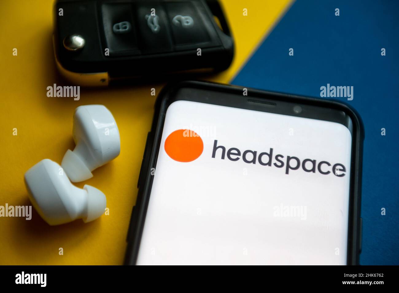 In this photo illustration a Headspace logo seen displayed on a