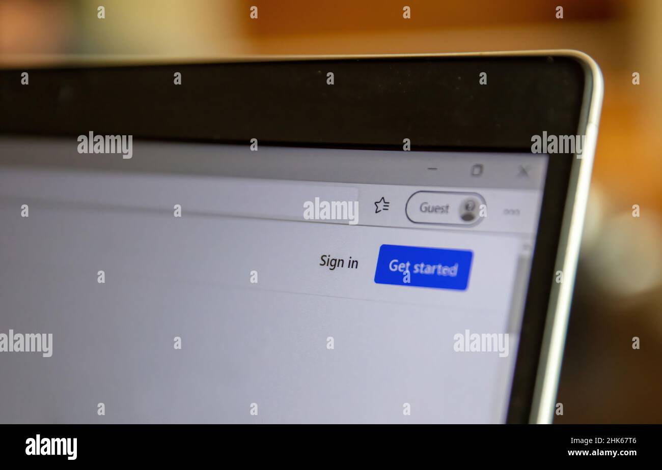 Sign in, get access to a computer system as a guest. Log in message on a digital device screen, closeup view. Stock Photo