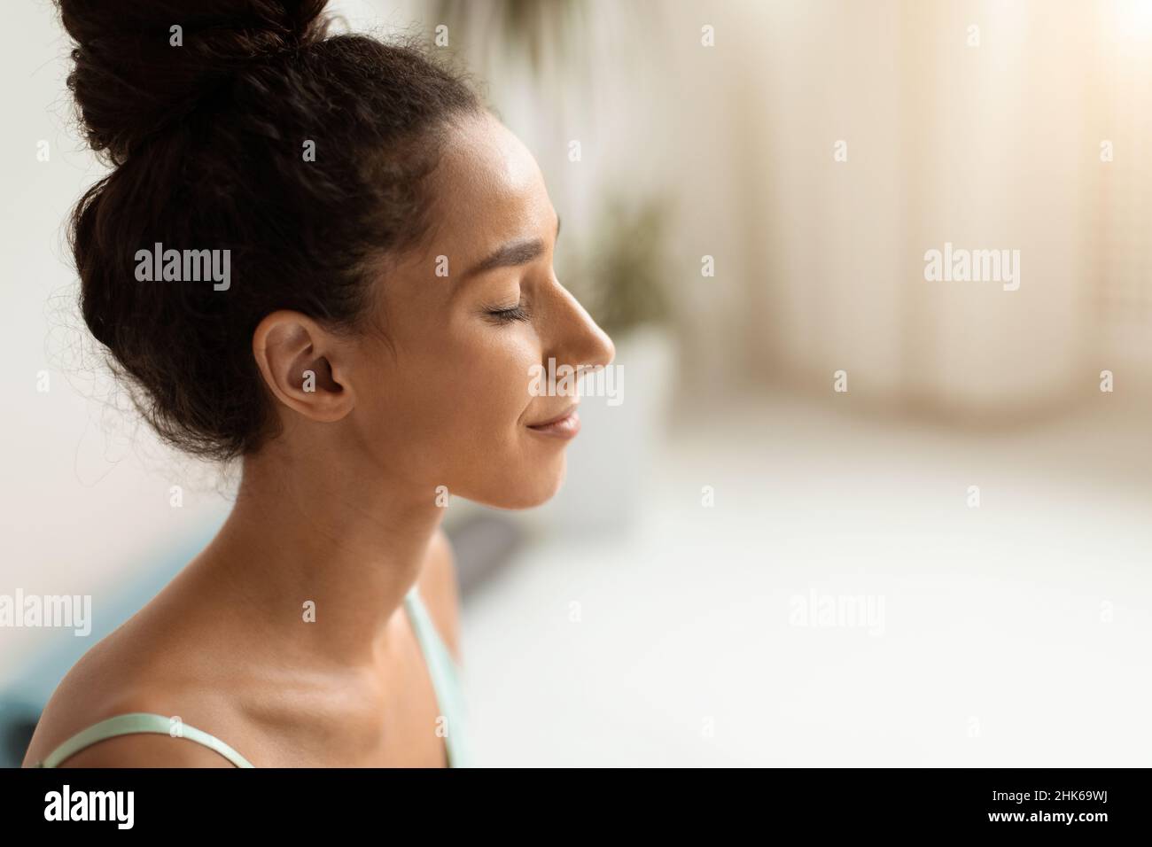 Mental Wellbeing. Closeup Shot Of Beautiful Calm Brunette Woman With Closed Eyes Stock Photo